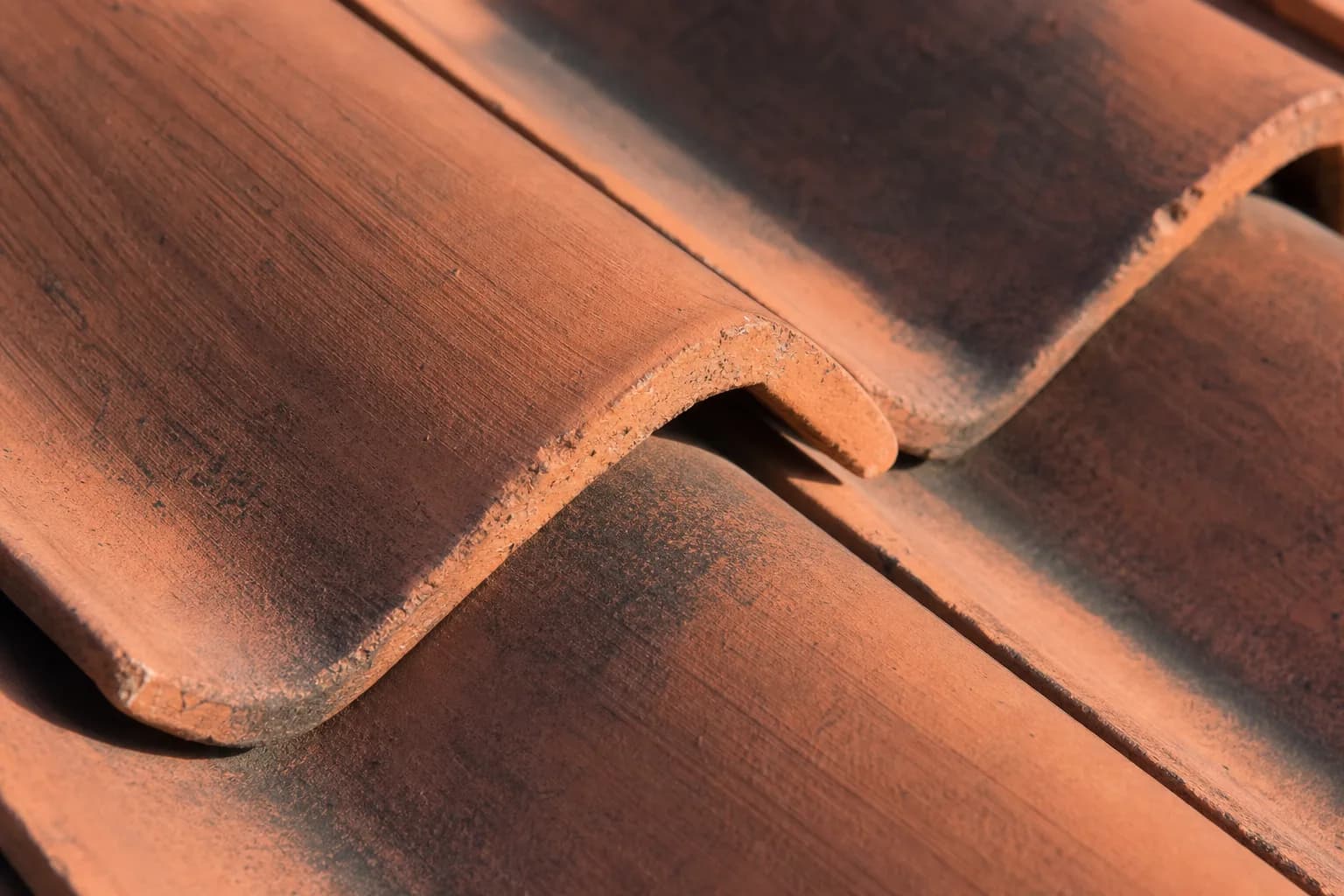 Close-up of high-quality overlapping terracotta clay roof tiles